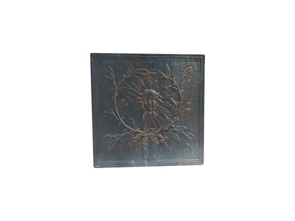 Plaque de cheminée ancienne avec le roi soleil