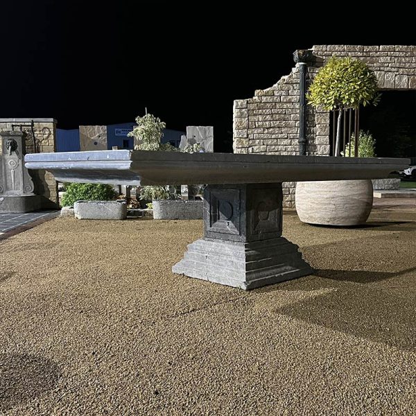 Table avec plateau en pierre et pied central